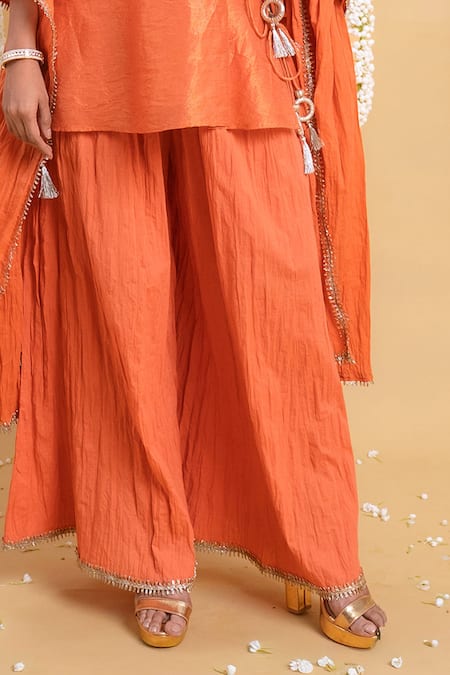 Grass & Sunshine_Rust Viscose Embroidery, Tassels, Lace V-neck Radiance Crinkled Sharara Set _Online_at_Aza_Fashions