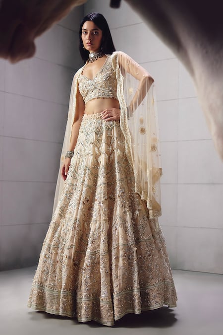 Buy_Awigna_Ivory Net Embroidery, Beads, Sequins V-neck Bridal Lehenga Set _Online_at_Aza_Fashions