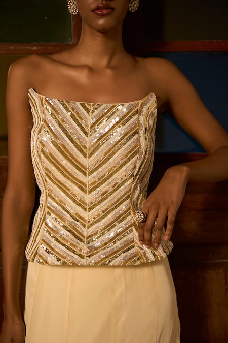 Saangi_Ivory Crepe, Viscose Sequins, Zari, Embroidery Ember Sculpted Corset With Skirt _at_Aza_Fashions