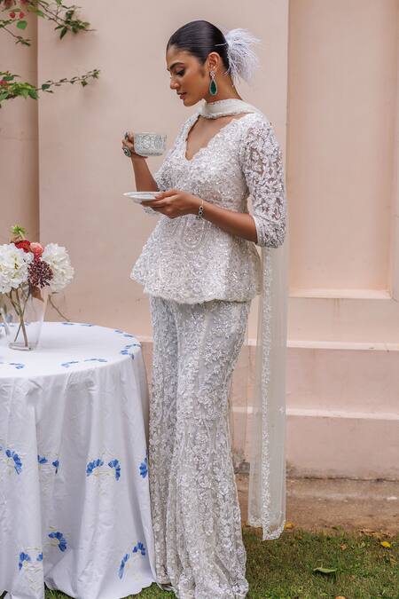 Meenagurnam_Ivory Net Sequins, Beads, Cut Work V-neck Embellished Peplum Kurta Sharara Set _Online_at_Aza_Fashions