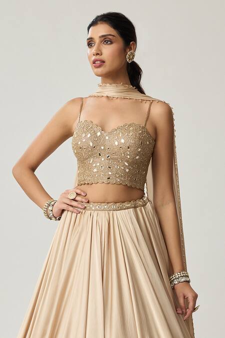 Buy Vvani By Vani Vats Beige Satin, Georgette Mirrors, Embroidery, Pom-poms Corset Blouse Lehenga Set Buy_Vvani By Vani Vats_Beige Satin, Georgette Mirrors, Embroidery, Pom-poms Corset Blouse Lehenga Set