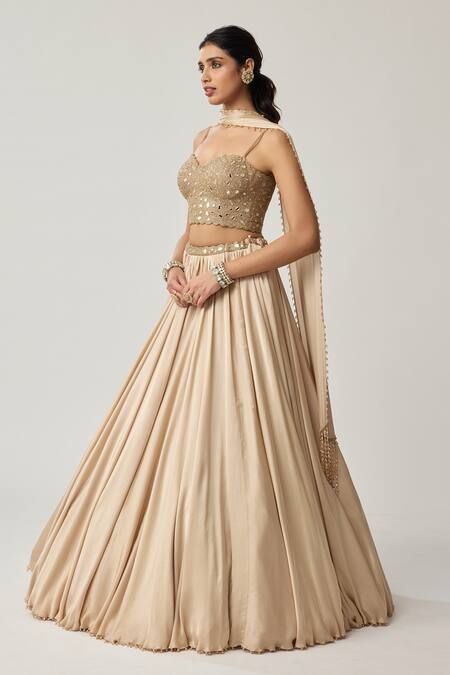 Shop Vvani By Vani Vats Beige Satin, Georgette Mirrors, Embroidery, Pom-poms Corset Blouse Lehenga Set Shop_Vvani By Vani Vats_Beige Satin, Georgette Mirrors, Embroidery, Pom-poms Corset Blouse Lehenga Set