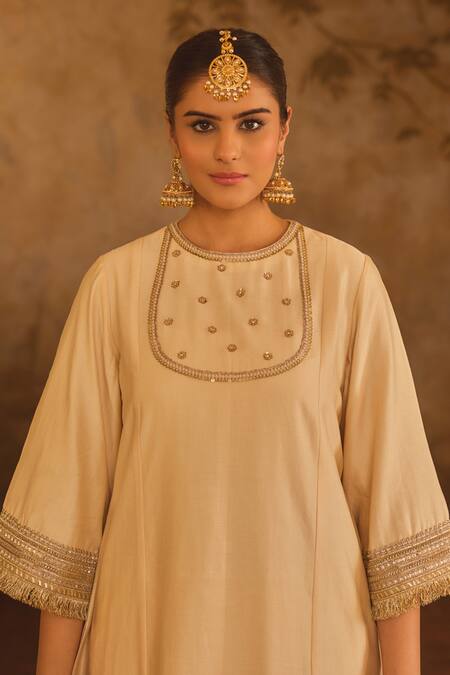 AFRIYA_Cream Chanderi , Organza Gota Patti, Metallic Border A-line Kurta Set _at_Aza_Fashions
