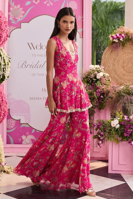 Shop Seema Thukral Pink Organza, Satin Embroidery, Mahima Printed Peplum Top And Flared Pant Set Online at Aza Fashions Shop_Seema Thukral_Pink Organza, Satin Embroidery, Mahima Printed Peplum Top And Flared Pant Set _Online_at_Aza_Fashions