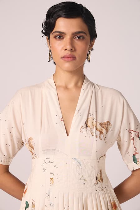 Buy The Summer House Cream Cambric, Cotton V-neck Aara Zodiac Print Pleated Midi Dress Online at Aza Fashions Buy_The Summer House_Cream Cambric, Cotton V-neck Aara Zodiac Print Pleated Midi Dress _Online_at_Aza_Fashions