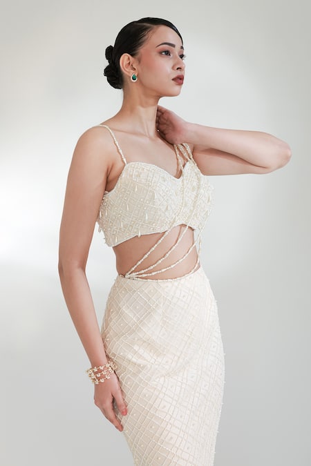 Libas Cafe by Nidhi & Ashish Ivory Net Pearls, Tassels, Embroidery Sweetheart Neck Power Glaze Skirt Set Online at Aza Fashions Libas Cafe by Nidhi & Ashish_Ivory Net Pearls, Tassels, Embroidery Sweetheart Neck Power Glaze Skirt Set _Online_at_Aza_Fashions