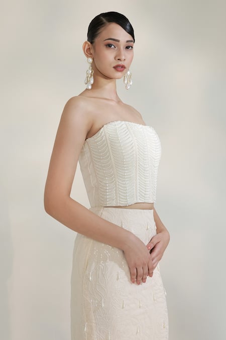 Libas Cafe by Nidhi & Ashish Ivory Crepe Pearls, Sequins Bandeau Halo Embroidered Corset With Fishcut Lehenga Online at Aza Fashions Libas Cafe by Nidhi & Ashish_Ivory Crepe Pearls, Sequins Bandeau Halo Embroidered Corset With Fishcut Lehenga _Online_at_Aza_Fashions