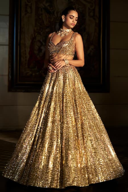 Buy_Seema Gujral_Gold Net Sequins, Crystals, Tassels, Embroidery Sweetheart Neck Lehenga Set _Online_at_Aza_Fashions
