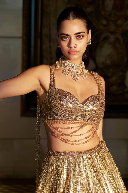 Shop_Seema Gujral_Gold Net Sequins, Crystals, Tassels, Embroidery Sweetheart Neck Lehenga Set _Online_at_Aza_Fashions