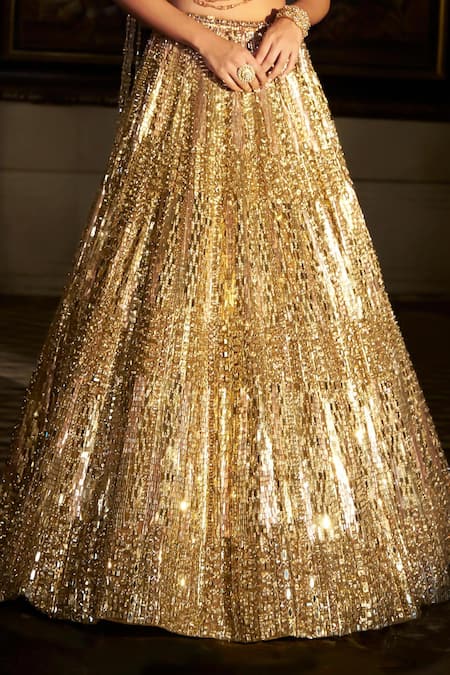 Seema Gujral_Gold Net Sequins, Crystals, Tassels, Embroidery Sweetheart Neck Lehenga Set _at_Aza_Fashions