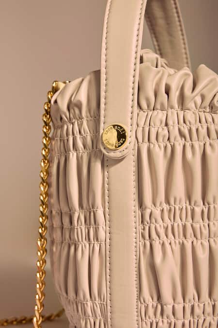 Buy_Tara And I_Cream Smocking, Chains Creme Drift Bucket Bag _Online_at_Aza_Fashions