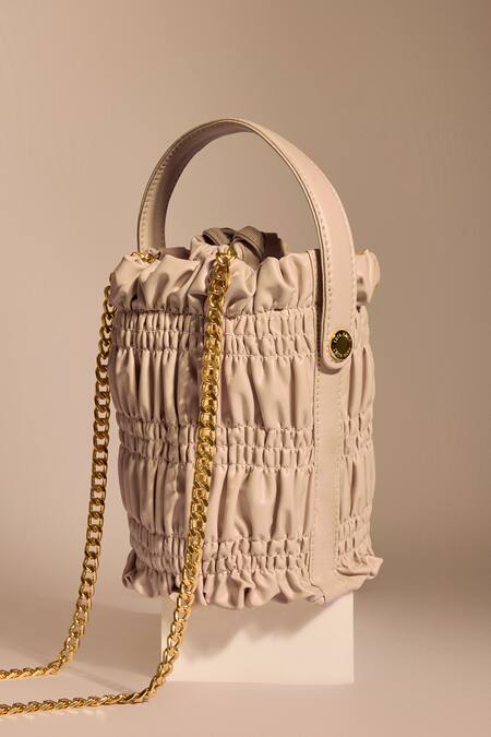 Shop_Tara And I_Cream Smocking, Chains Creme Drift Bucket Bag _Online_at_Aza_Fashions