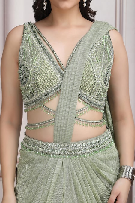 Mandira Wirk Resort_Green Lycra Sequins, Beads, Metallic Embellished Pre-draped Saree With Blouse _at_Aza_Fashions