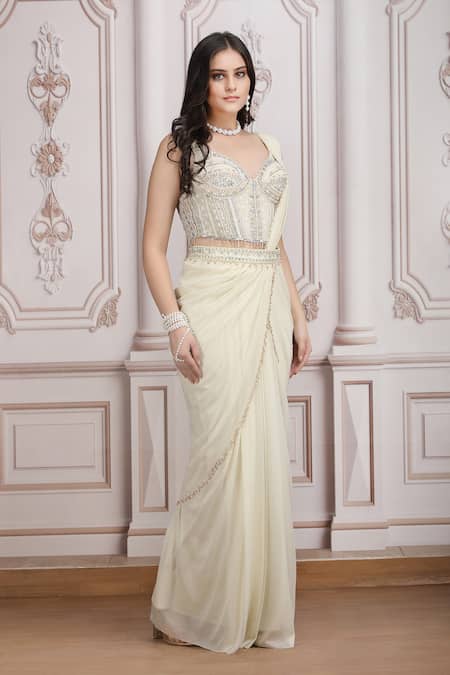 Buy_Mandira Wirk Resort_Ivory Jersey Sequins, Beads, Embellished Corset Blouse And Pre-draped Saree Set _Online_at_Aza_Fashions