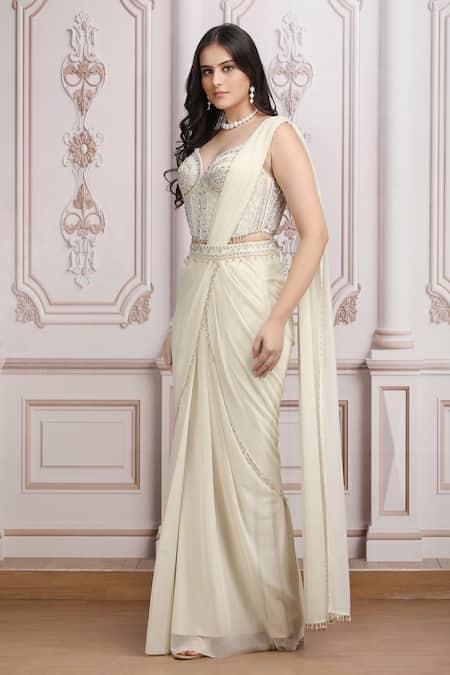 Shop_Mandira Wirk Resort_Ivory Jersey Sequins, Beads, Embellished Corset Blouse And Pre-draped Saree Set _Online_at_Aza_Fashions