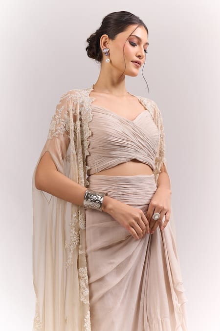 Anushree Reddy Beige Ruffles Open , Sweetheart Ivory Athena Embroidered Cape Skirt Set at Aza Fashions Anushree Reddy_Beige Ruffles Open , Sweetheart Ivory Athena Embroidered Cape Skirt Set _at_Aza_Fashions