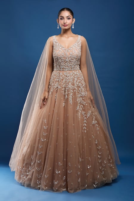 Samyukta Singhania_Gold Net Sequins, Stones, Embroidery V-neck Gown With Attached Cape _at_Aza_Fashions