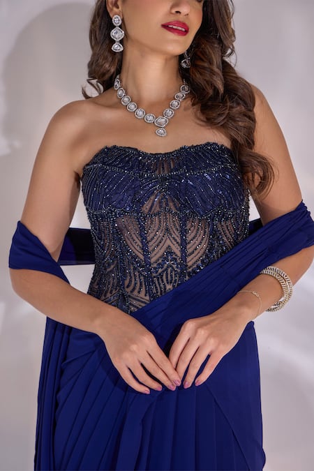 Rashika Sharma_Blue Georgette, Net Beads, Zari, Dori Pre-draped Saree With Embellished Corset _at_Aza_Fashions