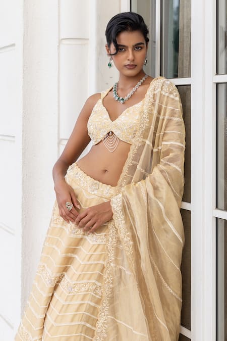 Buy House Of Armuse Yellow Tissue, Organza Embroidery, Beads, Chains, Metallic Ivory Lehenga Set Online at Aza Fashions Buy_House Of Armuse_Yellow Tissue, Organza Embroidery, Beads, Chains, Metallic Ivory Lehenga Set _Online_at_Aza_Fashions