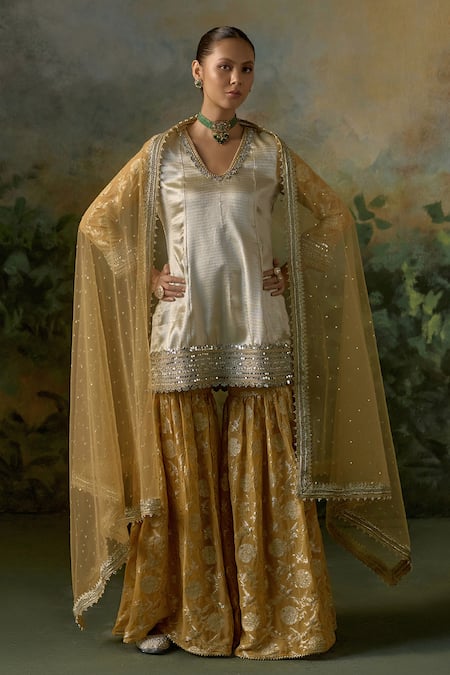 Mustard Moon By Neyha And Vrinda Gold Brocade, Georgette, Net Mirrors, Sequins, Pattern Kurta Sharara Set at Aza Fashions Mustard Moon By Neyha And Vrinda_Gold Brocade, Georgette, Net Mirrors, Sequins, Pattern Kurta Sharara Set _at_Aza_Fashions