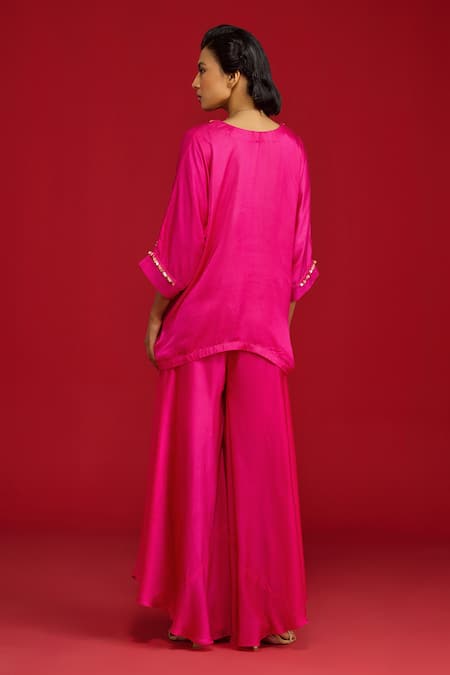 Shop Megha Pitti Pink Modal Sequins, Embroidery, Zari V-neck Hand Tunic With Flared Pant at Aza Fashions Shop_Megha Pitti_Pink Modal Sequins, Embroidery, Zari V-neck Hand Tunic With Flared Pant _at_Aza_Fashions