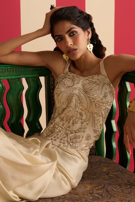 Megha Pitti_Ivory Modal, Satin, Crepe Sequins, Zari, Embroidery Corset Draped Skirt Set _at_Aza_Fashions