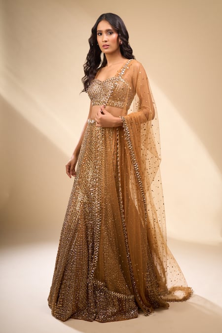 Seema Gujral_Gold Net Sequins, Beads Sweetheart Neck Embroidered Mermaid Lehenga Set _at_Aza_Fashions