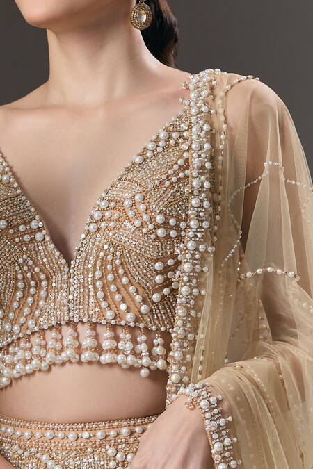 Shop_Seema Gujral_Beige Net Pearls, Sequins V-neck And Embellished Lehenga Set _Online_at_Aza_Fashions