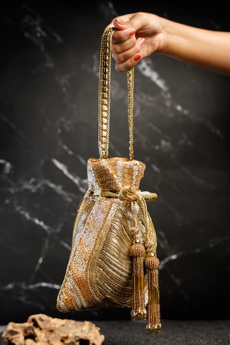 Buy_Nayaab By Sonia_Gold Tassels, Chains Hinted Metallic Potli _Online_at_Aza_Fashions