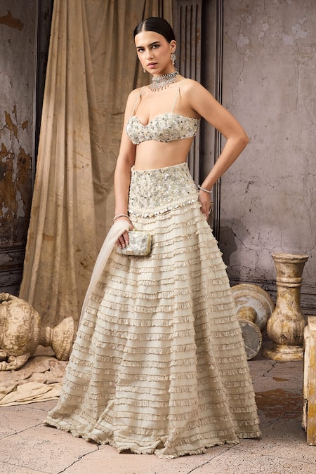 Shop Rocky Star Ivory Net, Silk Sequins, Beads, Ruffles Embellished Blouse And Tiered Lehenga Set Online at Aza Fashions Shop_Rocky Star_Ivory Net, Silk Sequins, Beads, Ruffles Embellished Blouse And Tiered Lehenga Set _Online_at_Aza_Fashions