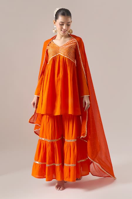 Shop Naintara Bajaj Orange Cotton Gota Patti V-neck Work Kurta Sharara Set Online at Aza Fashions Shop_Naintara Bajaj_Orange Cotton Gota Patti V-neck Work Kurta Sharara Set _Online_at_Aza_Fashions