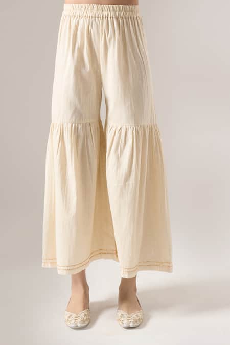 Naintara Bajaj Off White Cotton Lace, Gota Patti, Applique V-neck Embroidered Kurta Sharara Set at Aza Fashions Naintara Bajaj_Off White Cotton Lace, Gota Patti, Applique V-neck Embroidered Kurta Sharara Set _at_Aza_Fashions