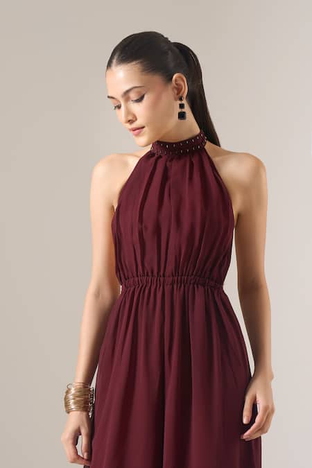 Naintara Bajaj_Brown Georgette Studs Halter Neck Solid Sleeveless Jumpsuit _Online_at_Aza_Fashions