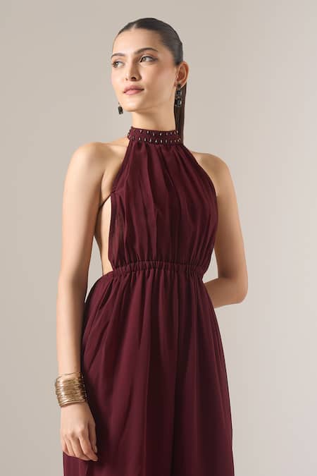 Naintara Bajaj_Brown Georgette Studs Halter Neck Solid Sleeveless Jumpsuit _at_Aza_Fashions