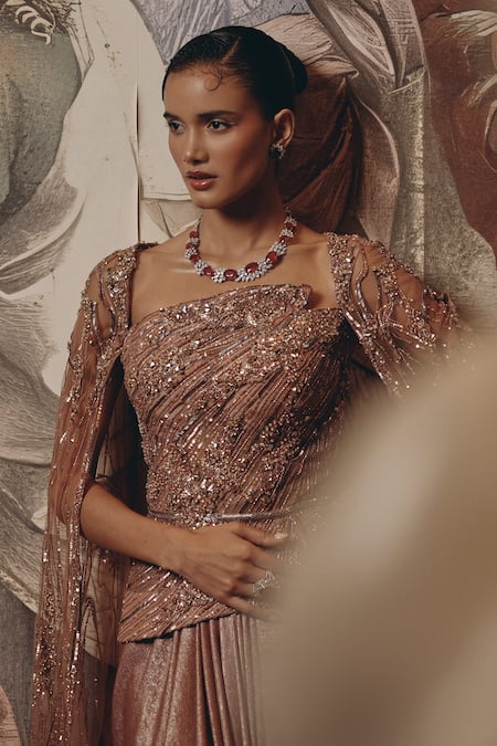 Adaara Couture_Rose Gold Net, Satin, Crepe Sequins Square Embellished Saree Gown With Cape _at_Aza_Fashions