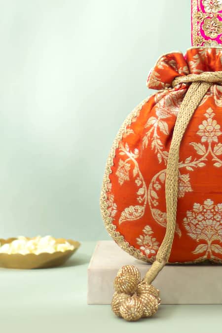 Amyra_Orange Embroidery, Zari, Tassels, Beads Taroob Handwoven Brocade Potli_Online_at_Aza_Fashions