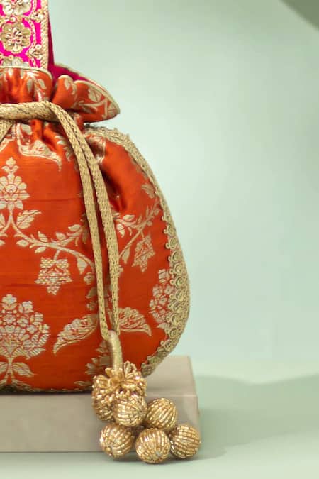 Shop_Amyra_Orange Embroidery, Zari, Tassels, Beads Taroob Handwoven Brocade Potli_Online_at_Aza_Fashions