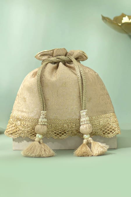 Shop_Amyra_Beige Tassels, Beads, Metallic Thread Nira Katan Silk Woven Potli Bag _at_Aza_Fashions
