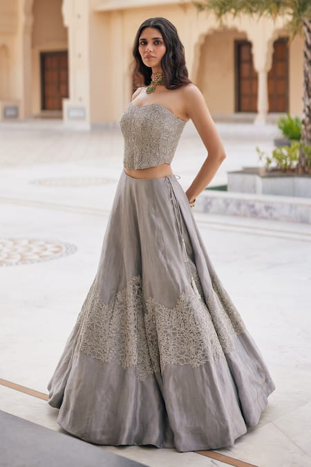 Charu And Vasundhara_Silver Tissue Embroidery, Sequins Krystabelle Embellished Corset Lehenga Set _at_Aza_Fashions