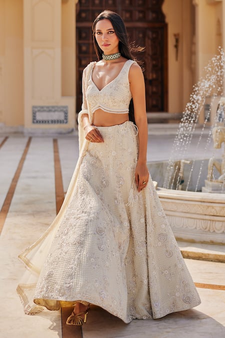Buy_Charu And Vasundhara_Ivory Net Embroidery, Sequins, Stones, Beads, Metallic Keziah Lehenga Set _Online_at_Aza_Fashions