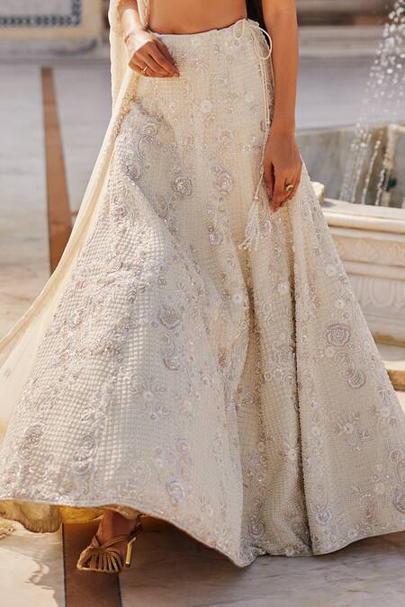 Shop_Charu And Vasundhara_Ivory Net Embroidery, Sequins, Stones, Beads, Metallic Keziah Lehenga Set _Online_at_Aza_Fashions