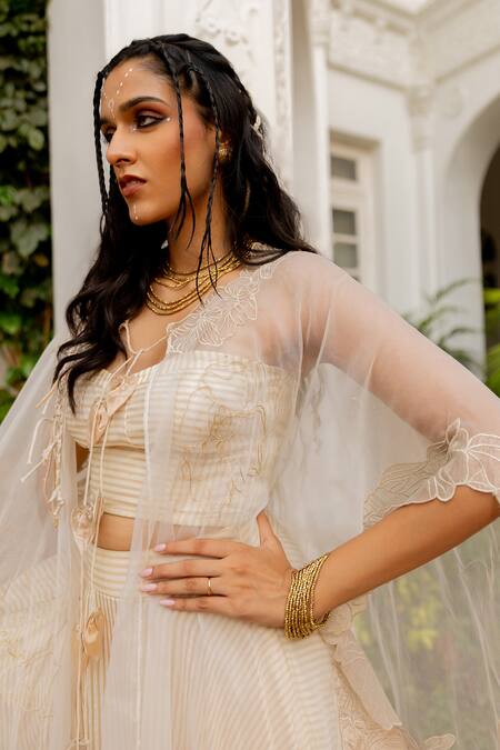 Chambray & CO._Ivory Cotton, Silk, Tissue Embroidery, Tassels Open Yutika Cape And Skirt Set _at_Aza_Fashions