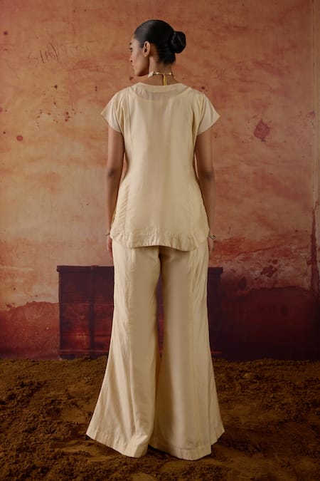 Shop Vinita Bhansali Ivory Silk Embroidery, Sequins, Zari V-neck Vaza Top And Palazzo Set at Aza Fashions Shop_Vinita Bhansali_Ivory Silk Embroidery, Sequins, Zari V-neck Vaza Top And Palazzo Set _at_Aza_Fashions