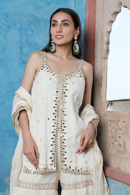 Nazar By Indu Ivory Cotton Mirrors, Embroidery, Gota Patti Scoop Strappy Kurta Sharara Set at Aza Fashions Nazar By Indu_Ivory Cotton Mirrors, Embroidery, Gota Patti Scoop Strappy Kurta Sharara Set _at_Aza_Fashions