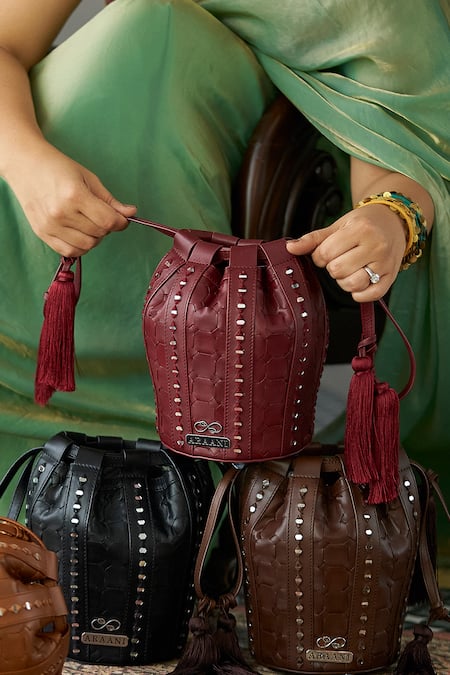 Araani Design_Maroon Embroidery, Tassels, Studs Sheesham Textured And Hand Potli _Online_at_Aza_Fashions