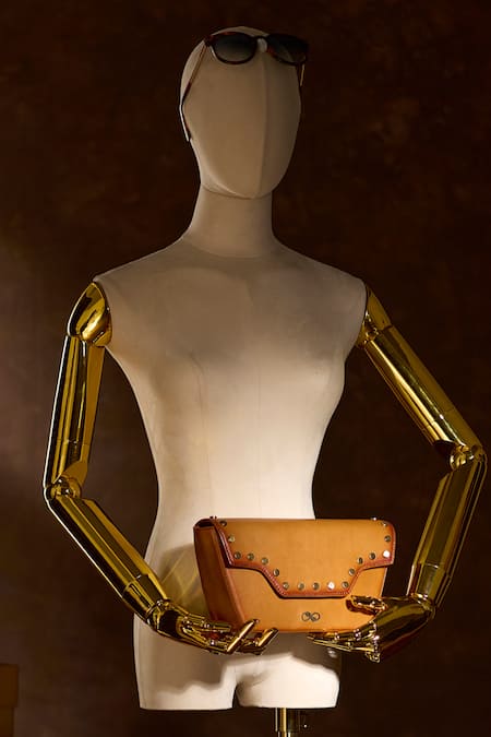 Buy Araani Design Tan Studs Tuscan Embellished Rivets Hand Clutch Online at Aza Fashions Buy_Araani Design_Tan Studs Tuscan Embellished Rivets Hand Clutch _Online_at_Aza_Fashions