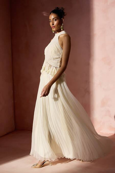 Shop Nitika Gujral Ivory Chiffon, Satin, Organza Pearls, Fringe Halter Pleated Skirt And Blouse Set Online at Aza Fashions Shop_Nitika Gujral_Ivory Chiffon, Satin, Organza Pearls, Fringe Halter Pleated Skirt And Blouse Set _Online_at_Aza_Fashions