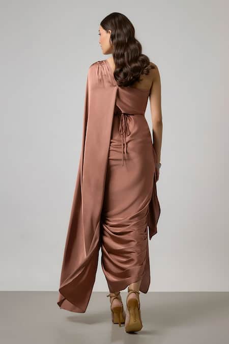 Shop NA-KA Brown Satin One Shoulder, Cowl Neck Pleated Gown at Aza Fashions Shop_NA-KA_Brown Satin One Shoulder, Cowl Neck Pleated Gown _at_Aza_Fashions