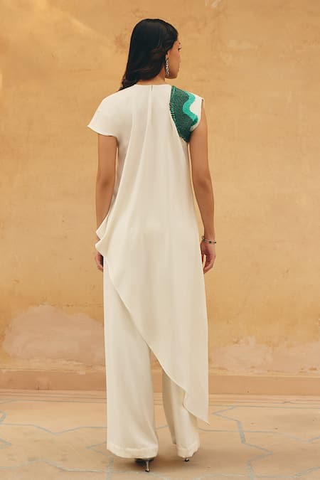 Shop Maenaam Ivory Polyester, Satin Sequins, Embroidery Margot Asymmetric Top And Pant Set at Aza Fashions Shop_Maenaam_Ivory Polyester, Satin Sequins, Embroidery Margot Asymmetric Top And Pant Set _at_Aza_Fashions