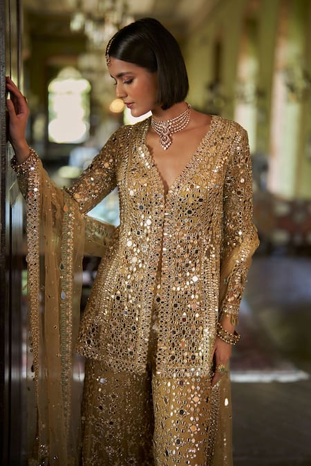 Seema Gujral_Gold Net Mirrors, Embroidery, Tassels Plunge Neck Work Jacket Sharara Set _at_Aza_Fashions